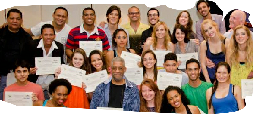 Group of graduates holding certificates at Mosaico arts workshop.